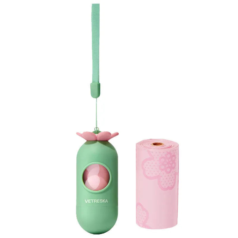 Portable dog waste bag dispenser capsule with scented inner bags in strawberry, orange, and cherry blossom options