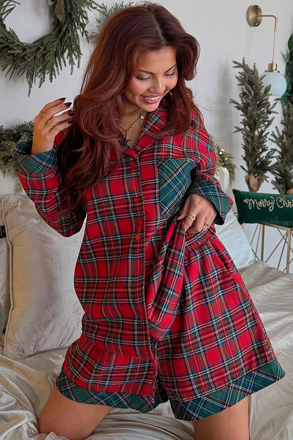 Red plaid Christmas pyjama set with contrast patches, showing long sleeve shirt and matching shorts
