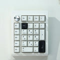 Wireless mechanical numeric keyboard in black and white colour options showing Bluetooth connectivity