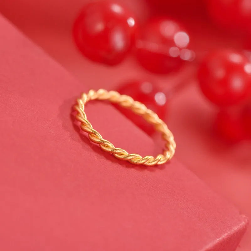Women's brass gold plated ring shown in simple bracelet and twist ring styles.