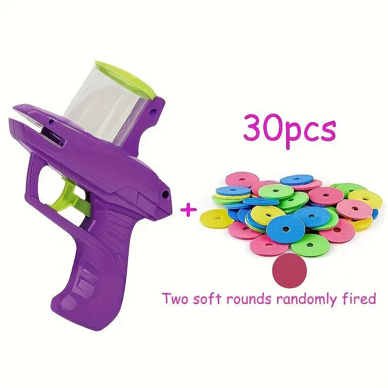 Interactive cat toy launcher in green or purple with foam discs for indoor play