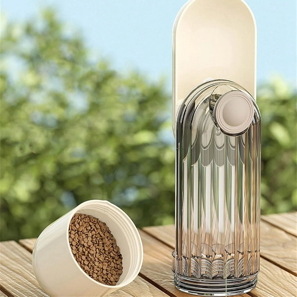 Beige and green foldable dog water bottle with food container, shown with press-to-dispense tray.