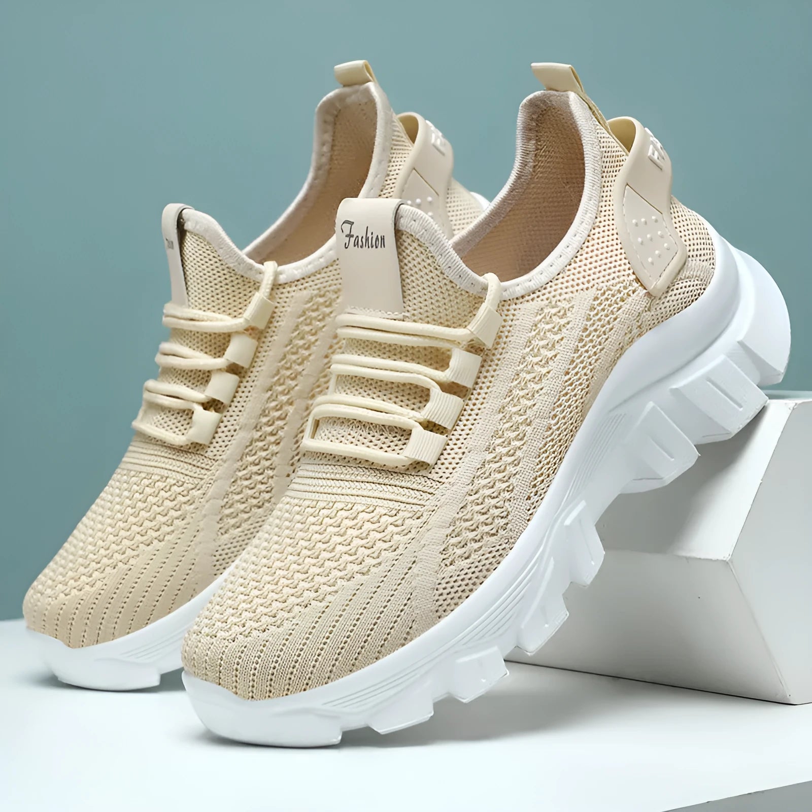 Women's white flyknit sneakers with round toe and flat PVC sole