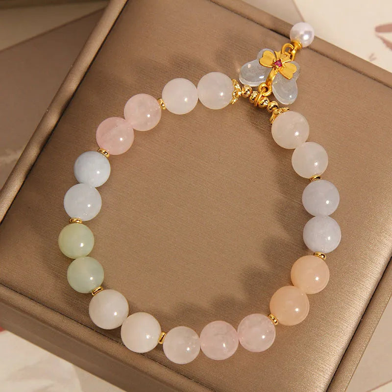 Women's crystal bead bracelet with a colourful natural Morganite stone butterfly pendant.