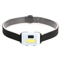 Compact blue outdoor LED headlamp with adjustable strap on a dark background.