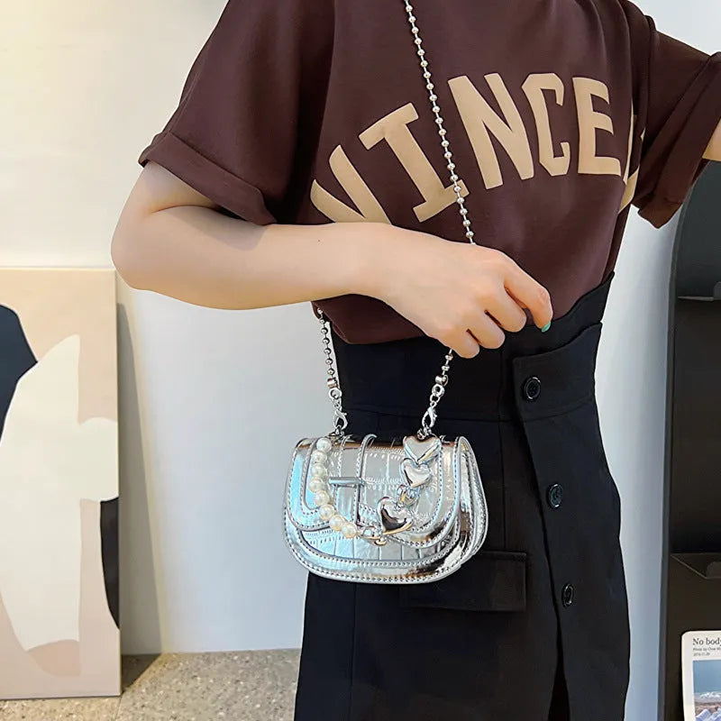 Silver PU leather women's crossbody bag with a horizontal square shape and single shoulder strap.