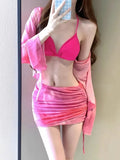 Women's blue four-piece bikini swimsuit set showing high-waisted briefs and coordinating shirt and skirt components