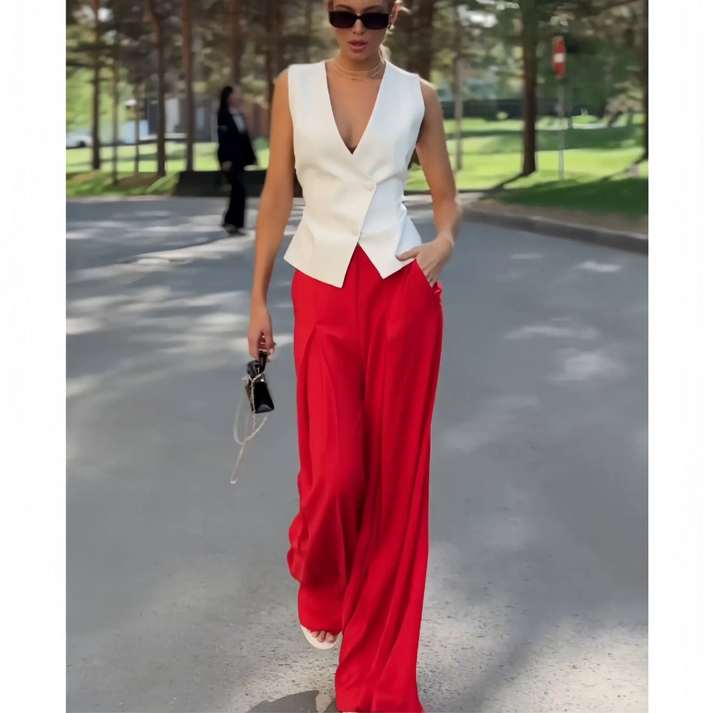 Women's beige two-piece set with deep V-neck sleeveless top and wide leg trousers