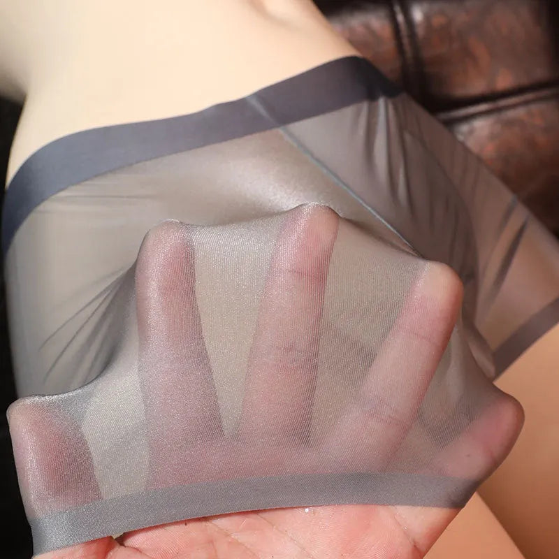 Men's ultra-thin transparent nylon boxer underwear shown in light gray, dark gray, skin colour, brown, cyan, and light blue.