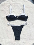 Black women's low waist bikini with stitching split detail on briefs, shown from front.