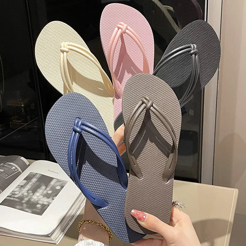 Men's PVC flip flop slippers in beige with a toe-covering design and injection moulded sole.