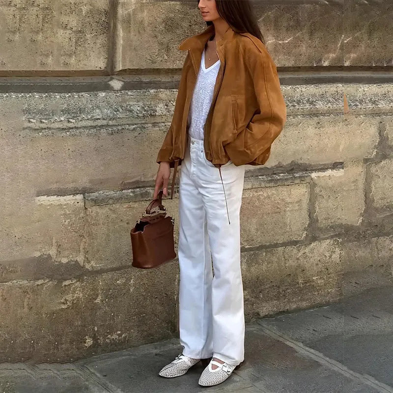 Man wearing a solid colour loose-fit retro polyester jacket