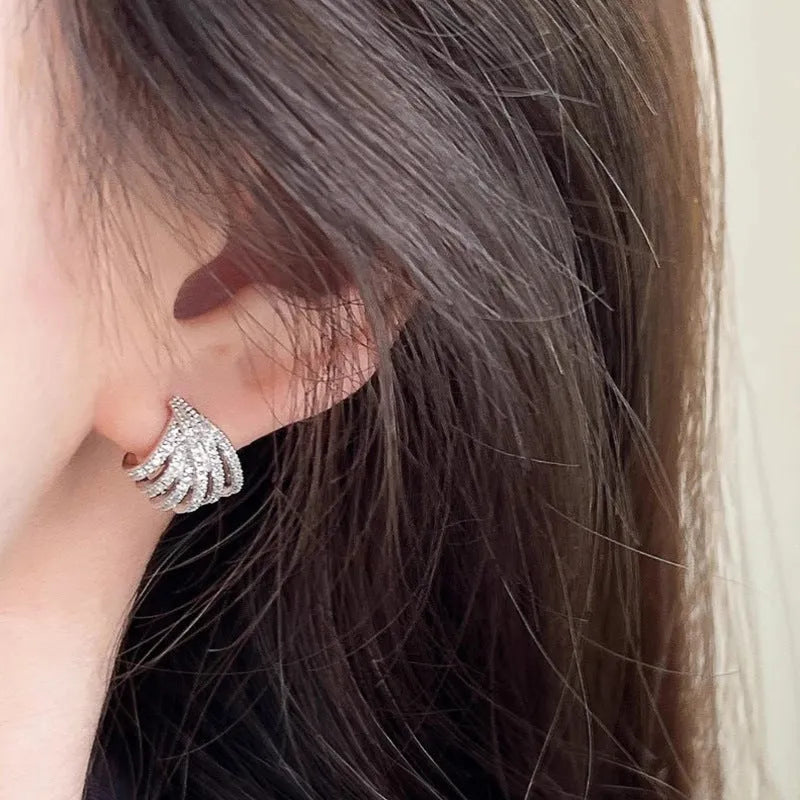 Geometric zircon earrings with platinum electroplated finish and line design detailing