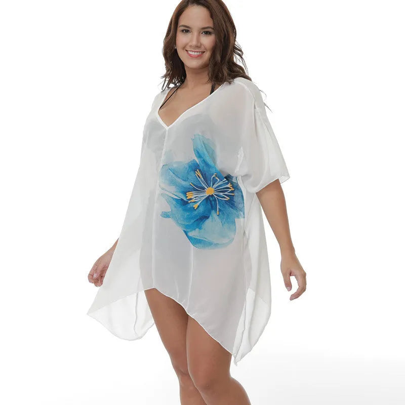 White plus size loose beach cover-up blouse for sun protection over swimwear.