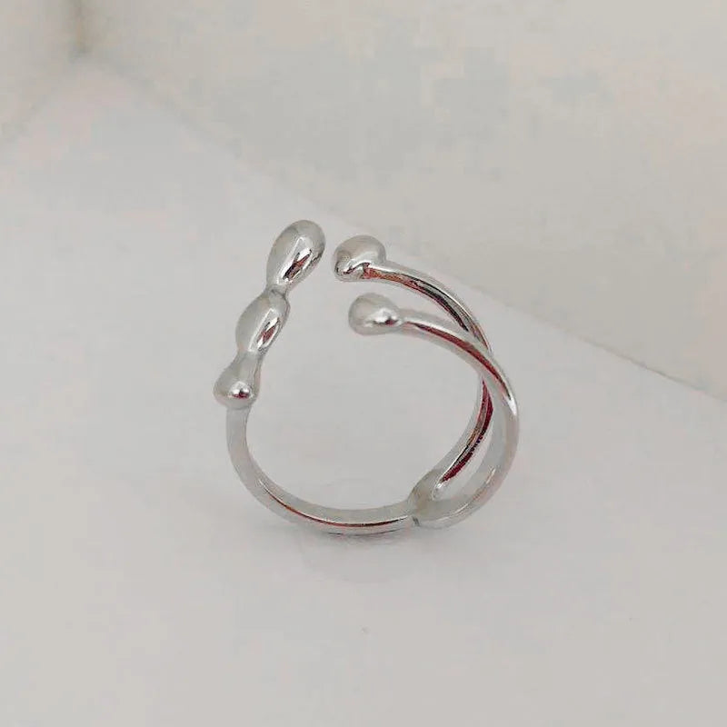Brass women's ring with spherical design in gold and silver colour options