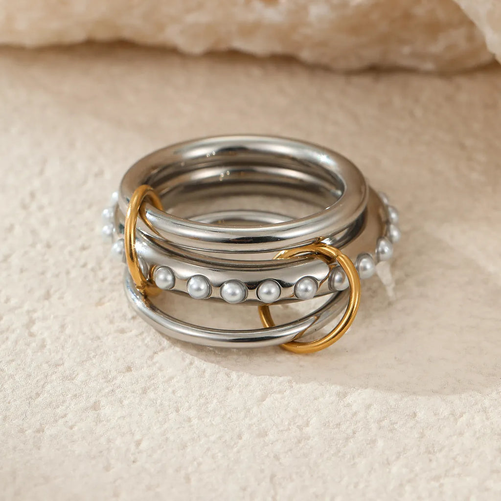 Gold plated stainless steel stacked ring set for women in an exaggerated design.