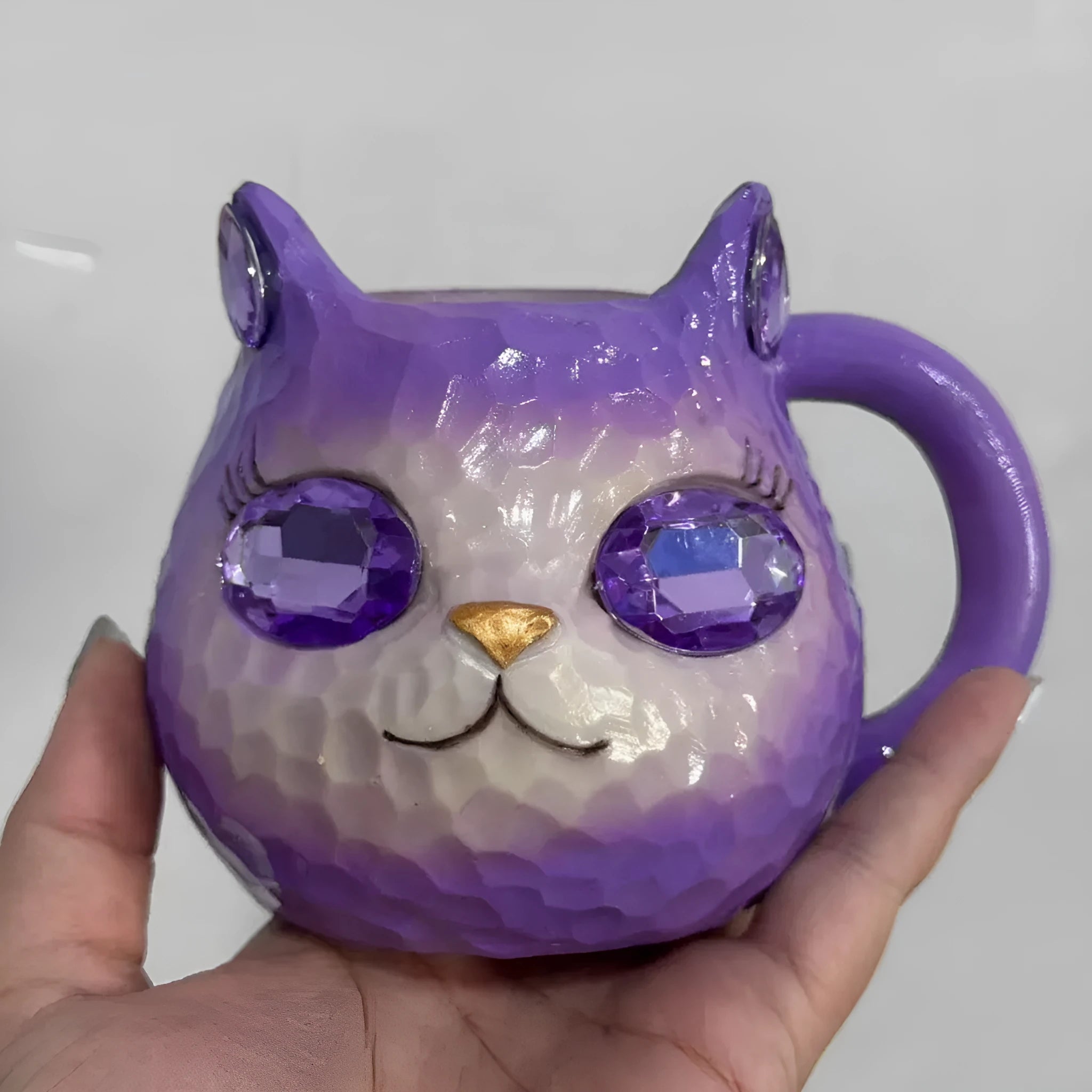 Resin crystal earth cat cup craft ornament in American style, shown in blue, green, pink, and purple colour options.