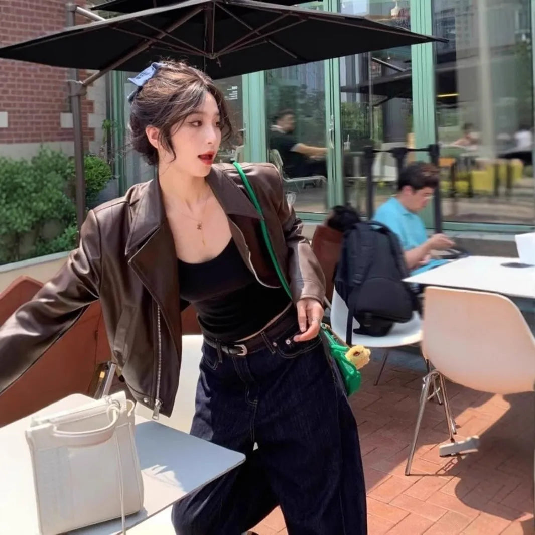 Women's brown retro imitation leather jacket with long sleeves, slim fit, and pockets.