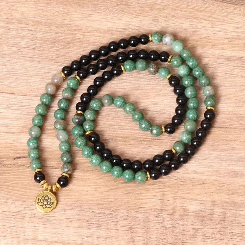 Green and black elastic beaded bracelet with alloy construction for women's wrist jewellery