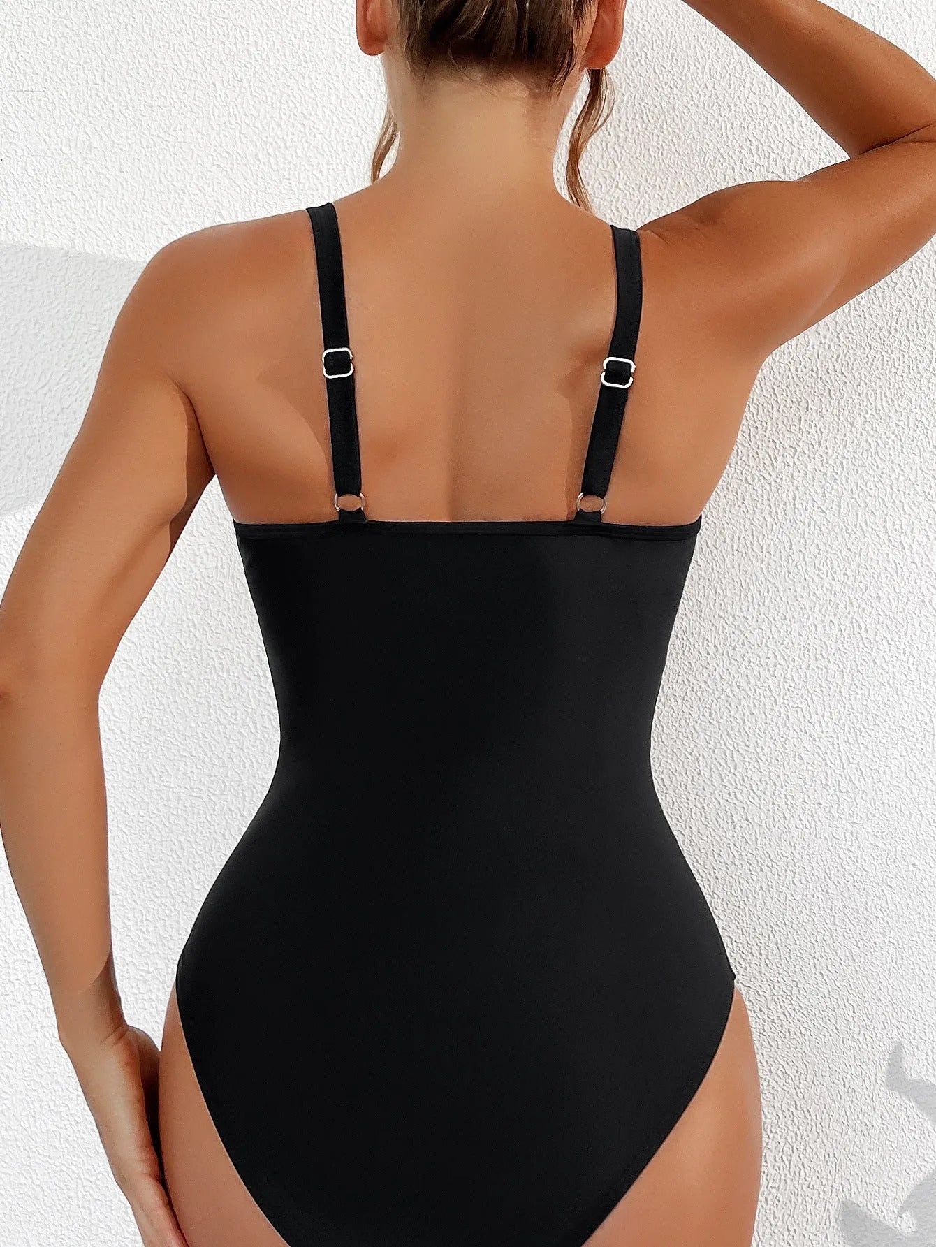 Black women's one-piece swimsuit with mesh halter neckline and briefs style bottom.