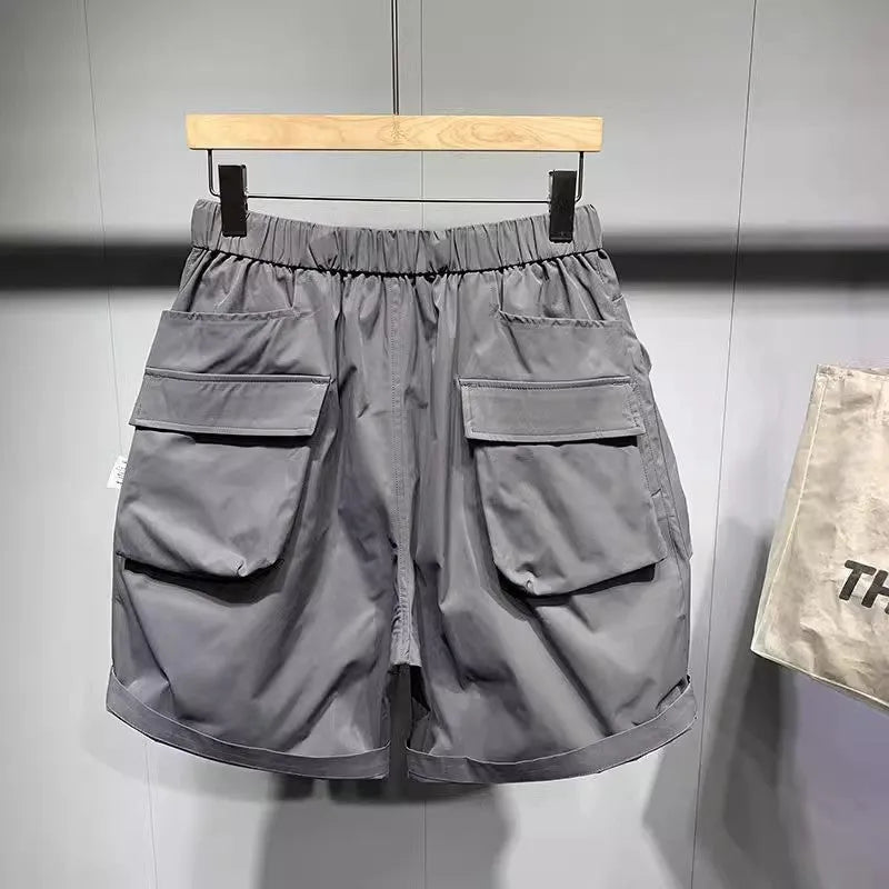 Men's black work shorts with multiple pockets and above-knee length
