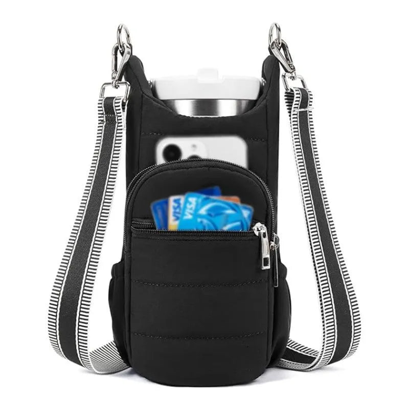 Kettle-shaped cycling water bottle bag in black colour mounted on bicycle handlebars