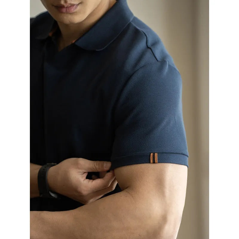 Men's blue cotton blend short-sleeve polo shirt on a hanger, showing the collar and regular fit.