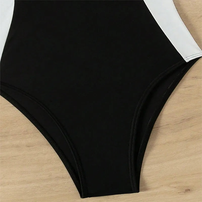 Women's black and white one-piece swimsuit with pearl spaghetti straps for swimming