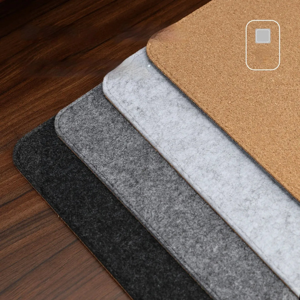 Japanese style simple desk mat in grey felt and cork, shown with keyboard and mouse.
