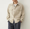Men's light sand rice casual shirt with a lapel collar and long sleeves.