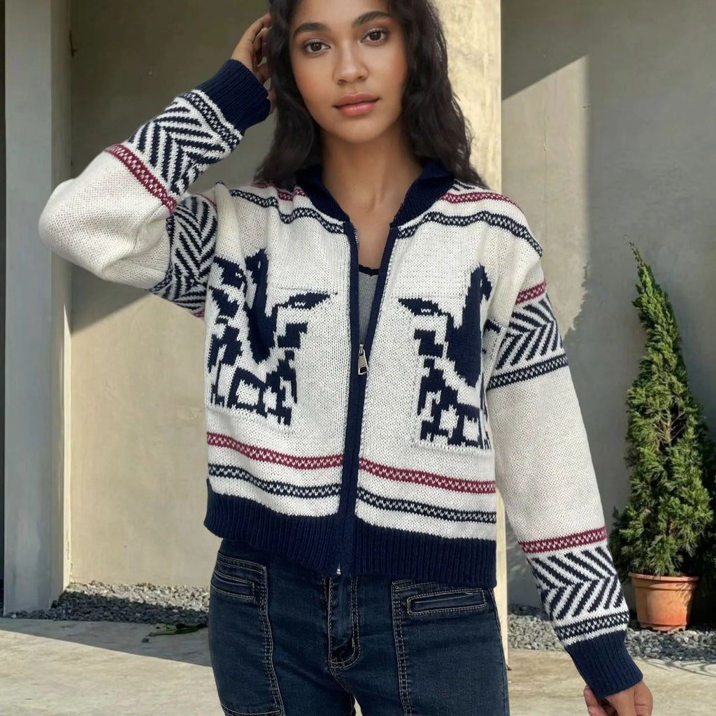 White women's cardigan with front zip, lapel collar, and jacquard contrast stripe pattern.