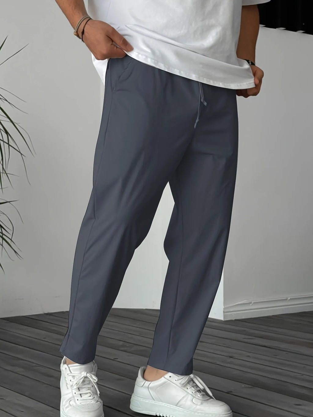 Men's khaki straight-leg casual trousers with drawstring waist and ribbon pockets.