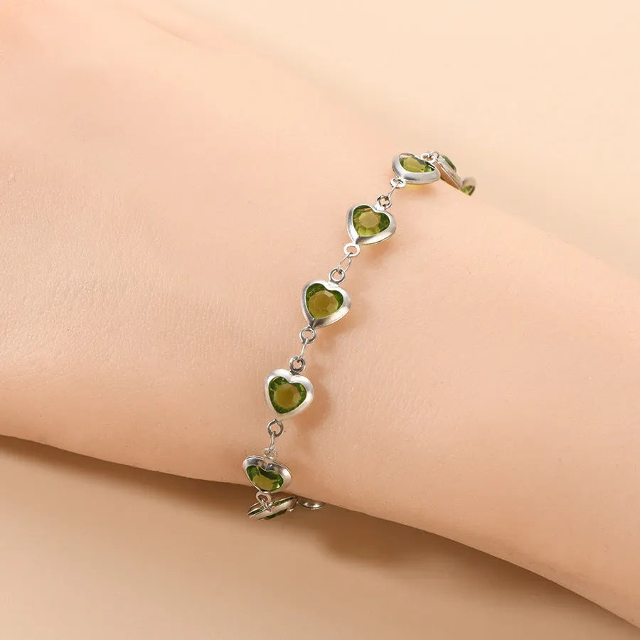 Devil's Eye geometric heart-shaped stainless steel bracelet in an electroplated colour on a wrist.