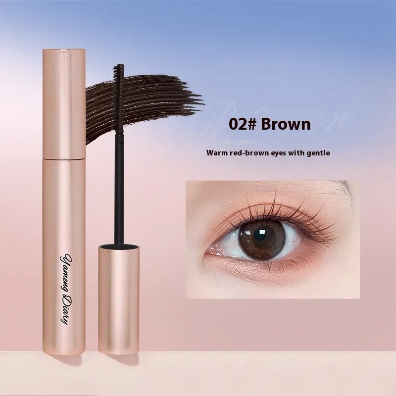 Black or brown long curling mascara tube and wand for lasting lash definition.