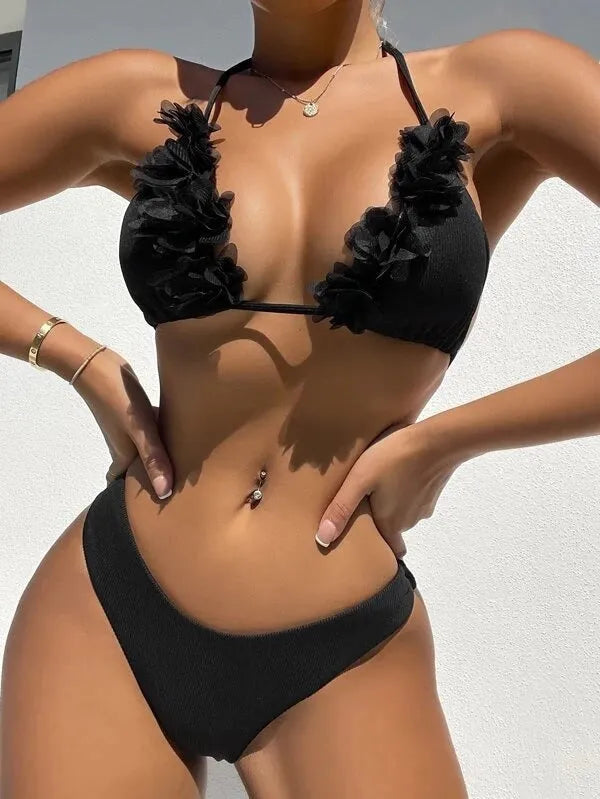 Black polyester two-piece swimsuit set with bikini top and gathered waist shorts.