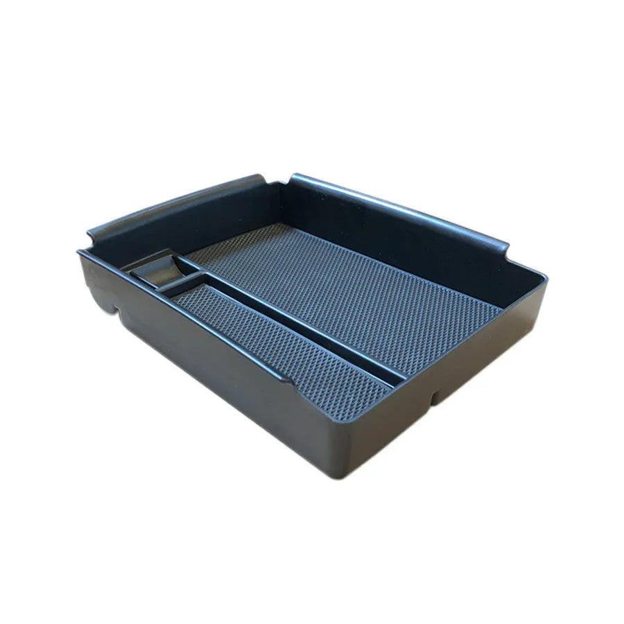 Black ABS wireless charging storage box and QI charging base stand on a desk.