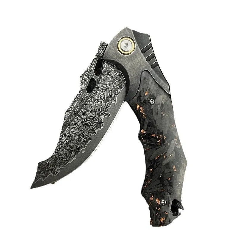 Damascus steel folding knife with carbon fibre handle and 9cm VG10 blade open on wood surface