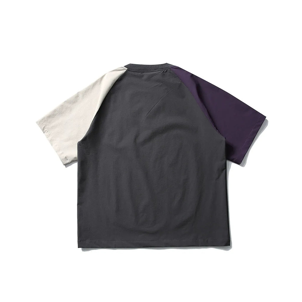 Dark grey men's loose fit t-shirt with contrast raglan sleeves on a neutral background