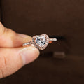 Women's heart-shaped crystal ring in rose gold or silver tone on a white background