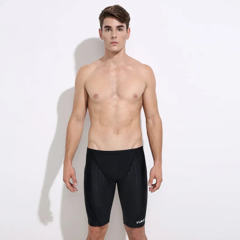 Men's black five-piece swimming set with trunks, anti-fog goggles, waterproof cap, ear plug nose clip, and storage bag