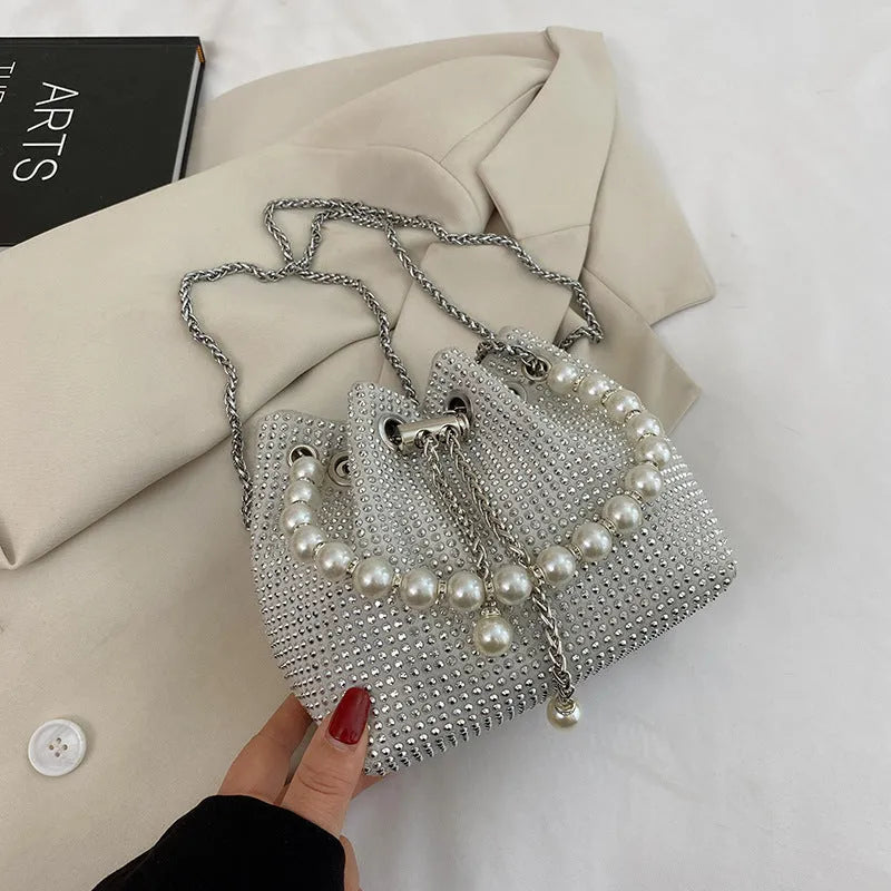 Soft PU leather crossbody bag with diamond embellishments and chain strap in bucket shape