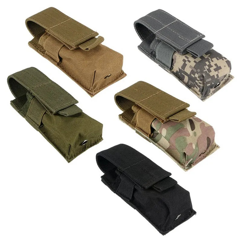 Black 600D nylon MOLLE tactical pouch with elastic cord closure, shown next to a small flashlight for scale.