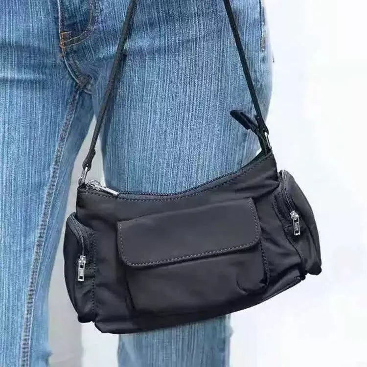 Black PU women's shoulder bag with double pockets showing side line detail, 24cm length
