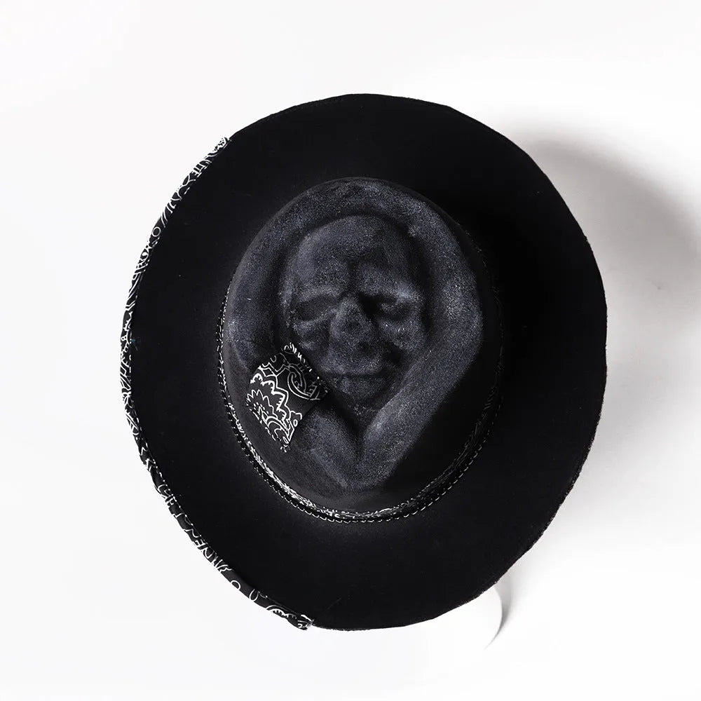 Handmade wool Halloween skull hat with a conical crown on a denim hat base.