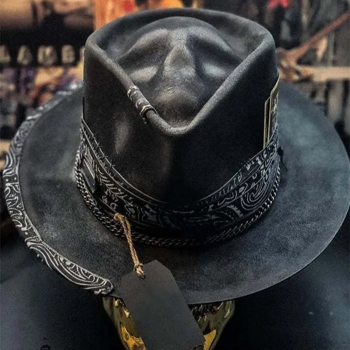 Handmade wool Halloween skull hat with a conical crown on a denim hat base.