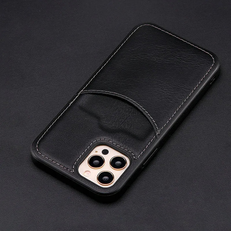 Dark blue PU leather protective phone case for iPhone on a table.