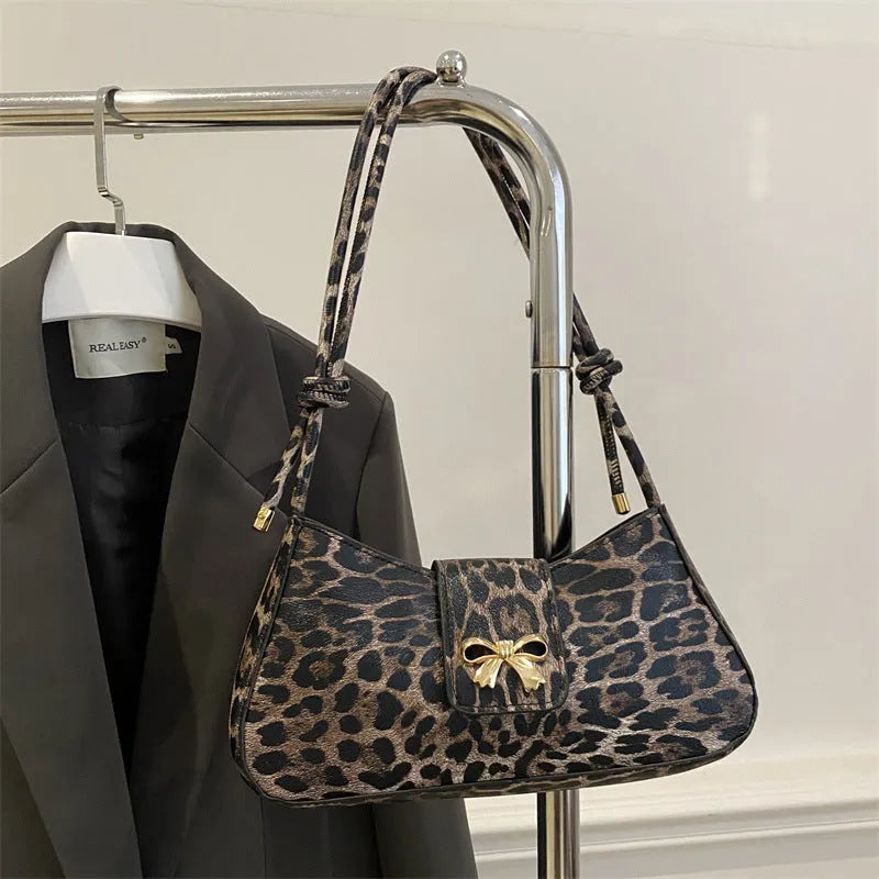 Large capacity casual women handbag in PU material with sandwich pocket design shown in black brown coffee and khaki colours