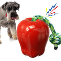 Green apple-shaped plastic dog toy with treat-dropping ball and molar-textured surface