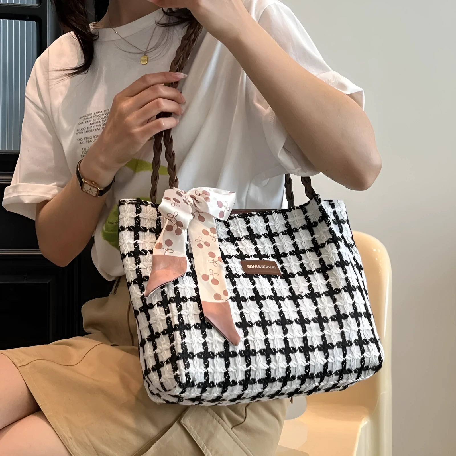 Horizontal square woolen shoulder bag with internal mobile phone and file compartments in black colour