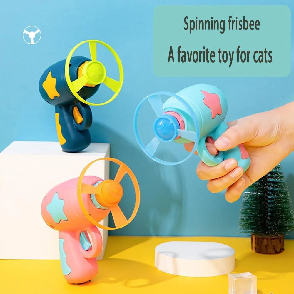 Blue plastic cat toy gun with spinning frisbee launch mechanism for indoor cats